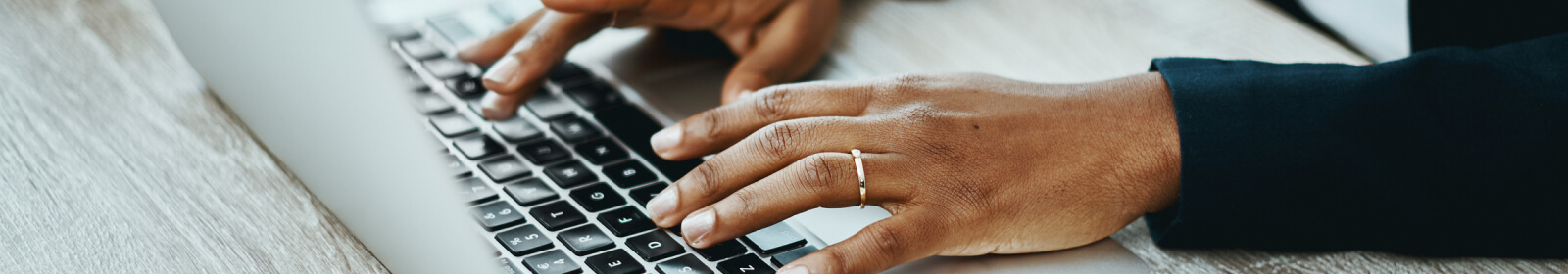 Person typing on laptop